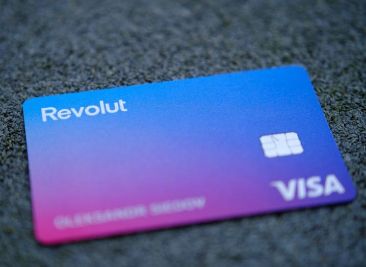 A blue and purple Revolut Visa debit card.