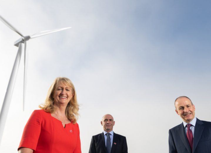 Members of Johnson & Johnson Ireland's team pictured outside at a windfarm with Taoiseach Micheal Martin.