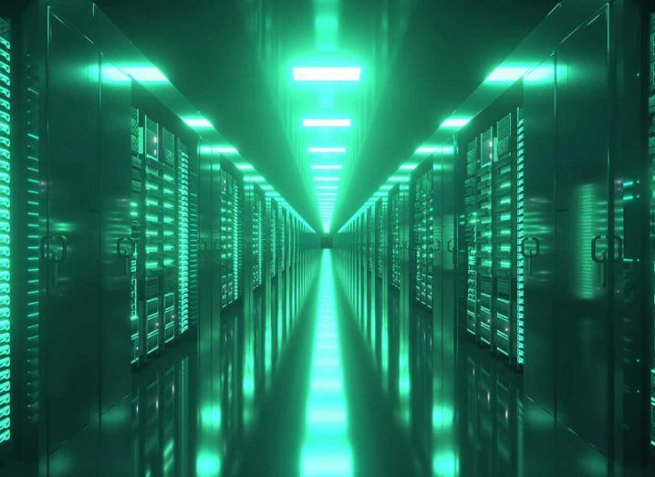 A view of a corridor in one of the world's many data centres illuminated in green.