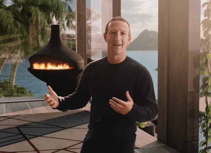 Mark Zuckerberg gestures in a virtual home space created for the launch of Meta, a new name for Facebook reflecting the company's focus on the metaverse.