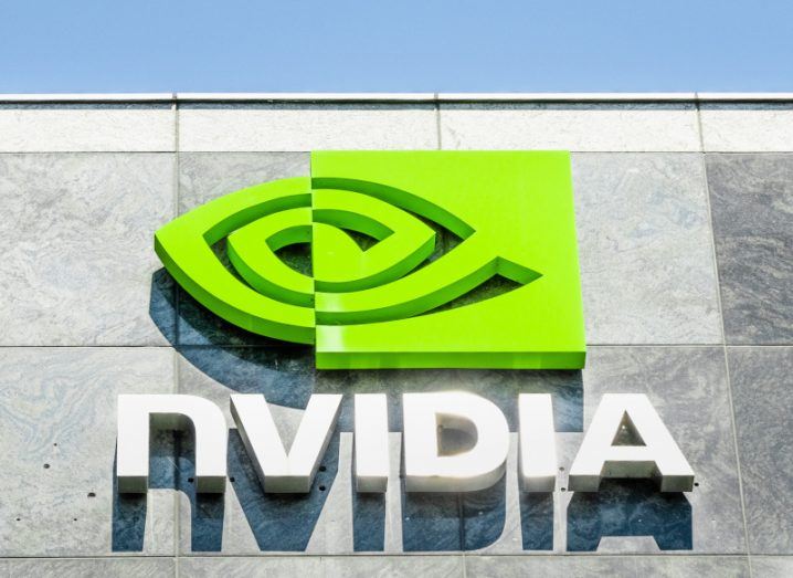 Nvidia green eye logo on its Santa Clara headquarters with blue sky above.