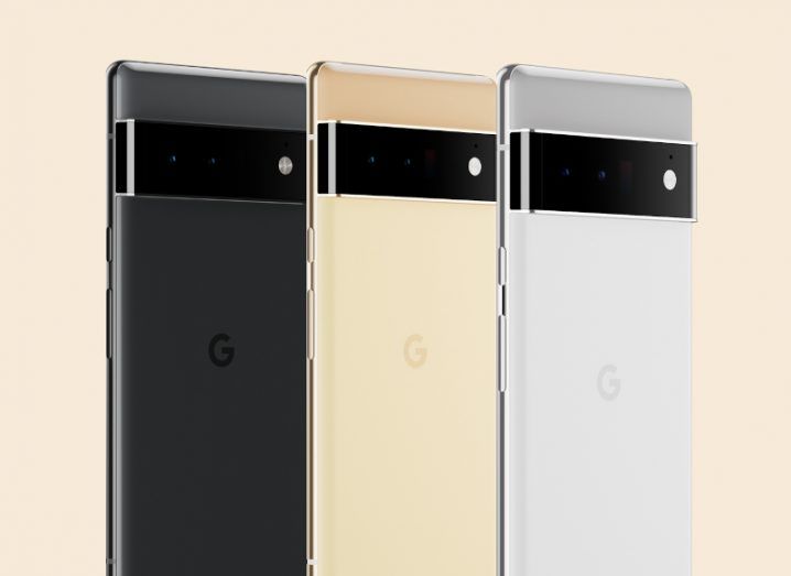 Google's Pixel 6 Pro smartphones in black, sand and gold colours against a light yellow background.