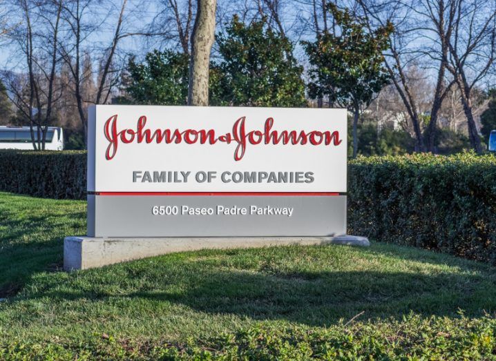 A Johnson & Johnson sign on the grass outside a company office.