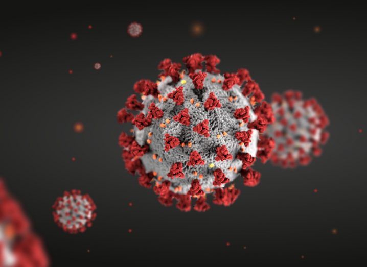 The structure of a coronavirus, with red spikes emerging from a spherical molecule.