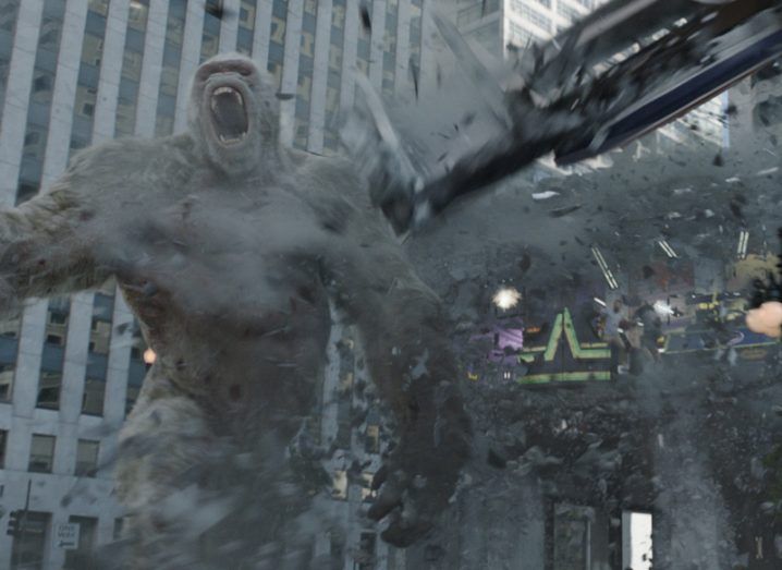 An impressive visual effects image with King Kong mid-rampage in a busy city district.