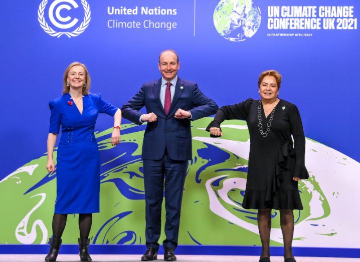 Liz Truss, foreign secretary of the UK, Taoiseach Micheál Martin and Patricia Espinosa, executive secretary of the UNFCC, bumping each others' elbows at COP26 in Glasgow.