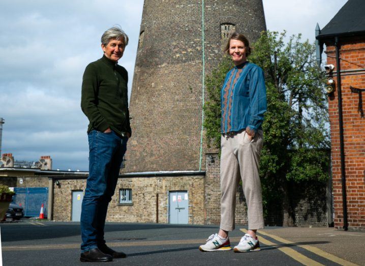 Fiach Mac Conghail and Seoidín O’Sullivan stand on the grounds of the Digital Hub campus at the foot of St Patrick’s Tower, a former smock windmill.