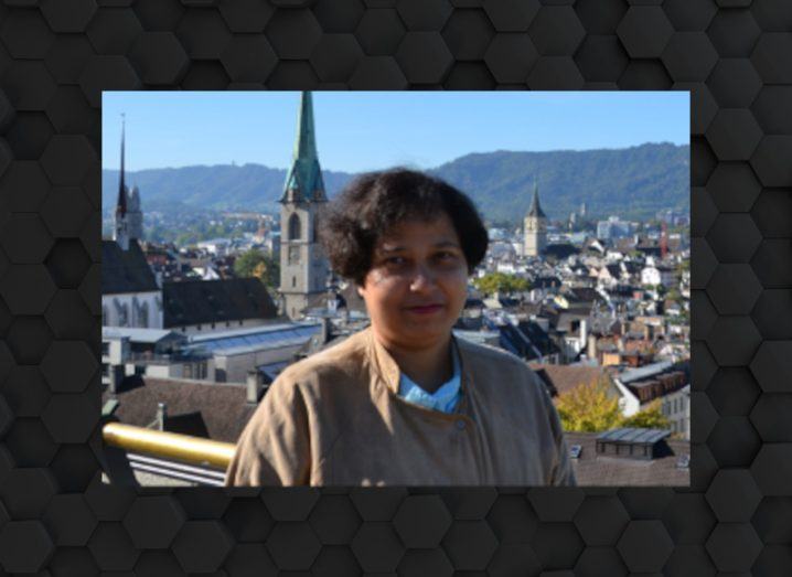 An image of a woman overlooking a cityscape.