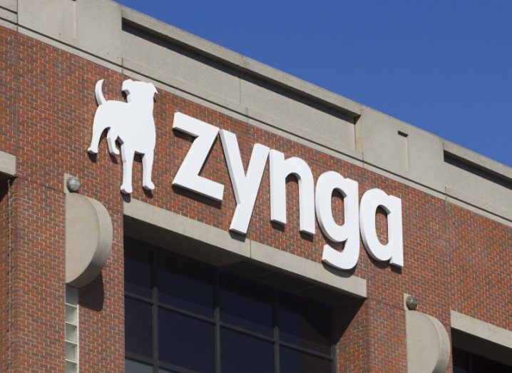 Zynga logo on a brown and grey building with a blue sky above it.