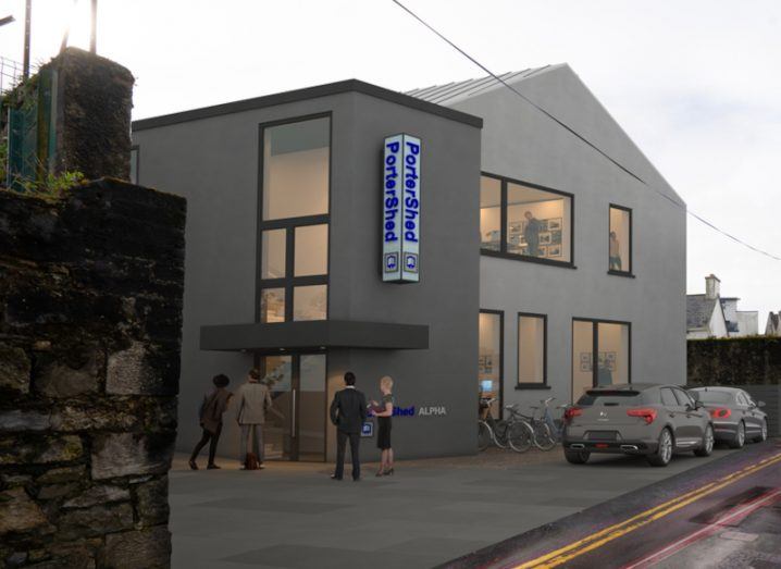 Portershed's new planned building in Galway, with people standing outside and at the office windows, with a grey sky overhead.