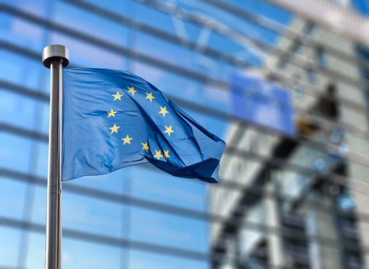 EU flag in front of the European Parliament building.