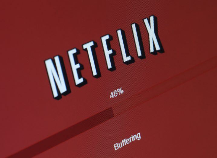 Netflix logo on a screen with a loading bar suck at at 48 percent below it. Text below the bar reads "buffering".