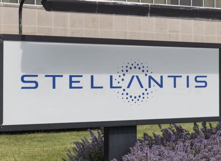Stellantis logo on a board in front of a building.