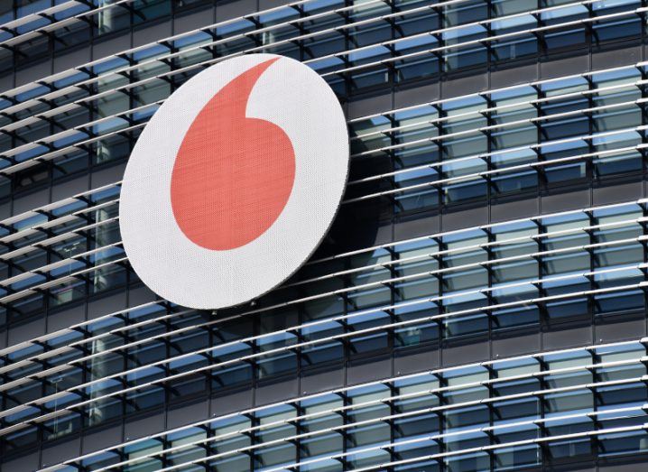 Vodafone logo of a red open inverted comma on a building.