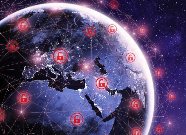 Image of the earth with red unlocked icons surrounding it, representing cyberattacks and ransomware around the world.