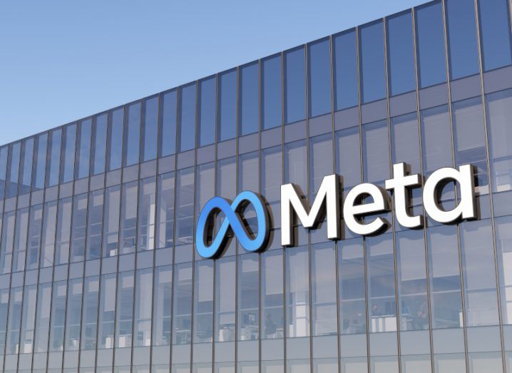 Meta logo on a glass building.
