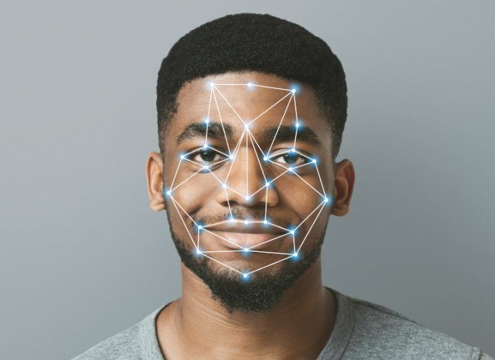 Headshot of man's face with lines connecting dots all over the face to indicate facial recognition technology.
