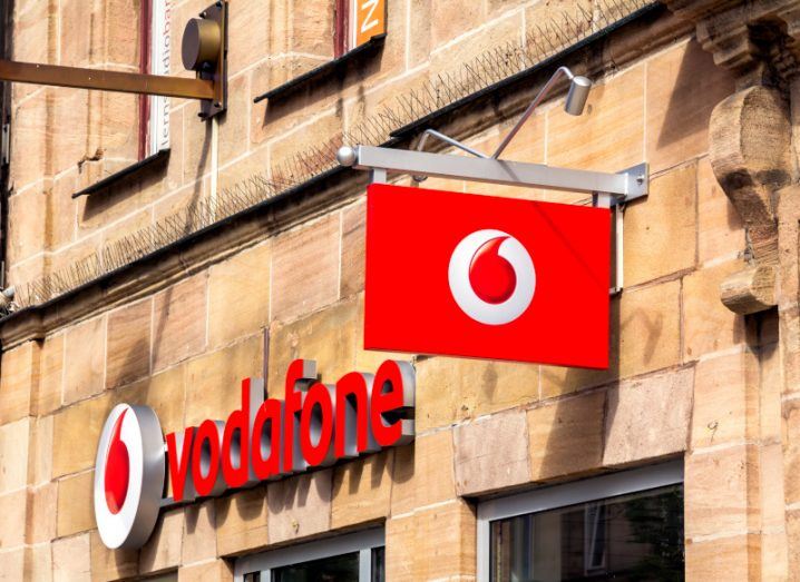 Vodafone signage and logo on a building in daylight.