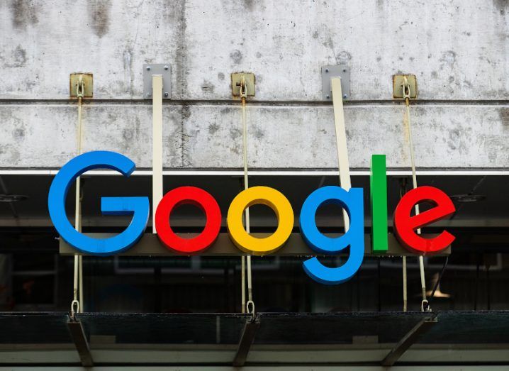 The Google logo outside a grey building.
