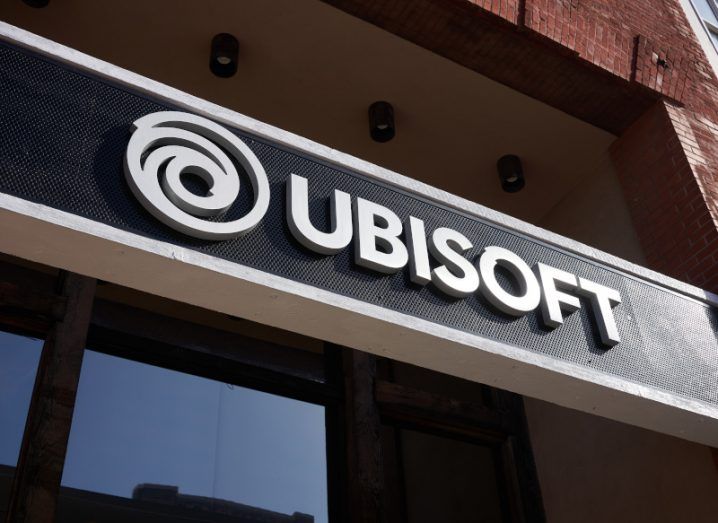 Ubisoft logo in front of a building, with the photo being taken from below.