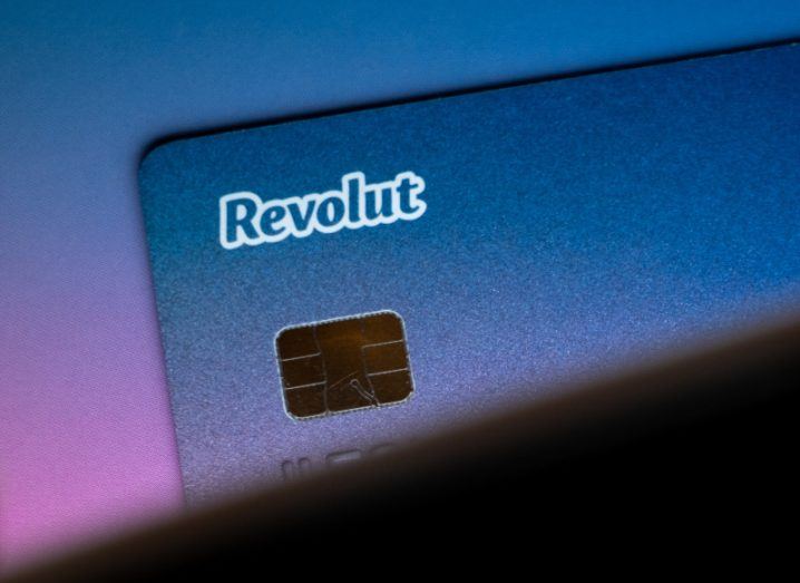 Close-up of an indigo-coloured Revolut card with the Revolut lettering in white.