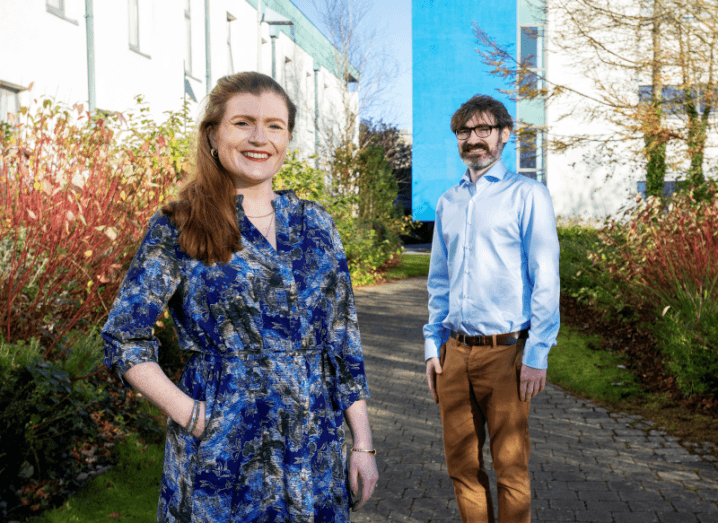 Tympany Medical founders Dr Liz McGloughlin and Rory O’Callaghan standing outside on a sunny day.