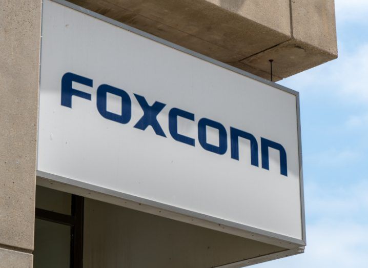 Foxconn logo on a white board on a building.