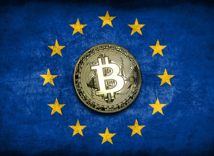A physical bitcoin in the centre of the EU flag.