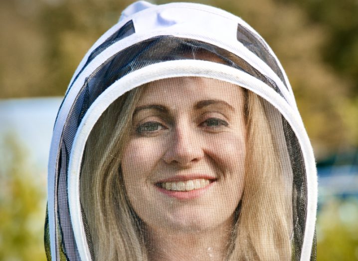 Headshot of Dr Fiona Edwards Murphy wearing a beekeeping suit.