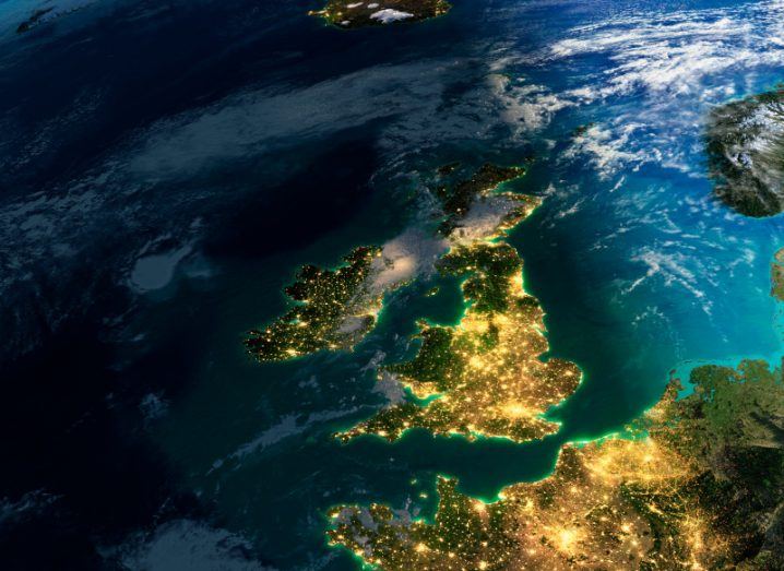 A map of Ireland and the UK with glowing lights appearing on densely populated areas.