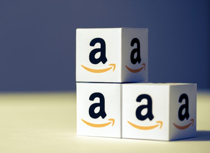 Three paper boxes stacked on top of each other with the Amazon logo printed on each one.