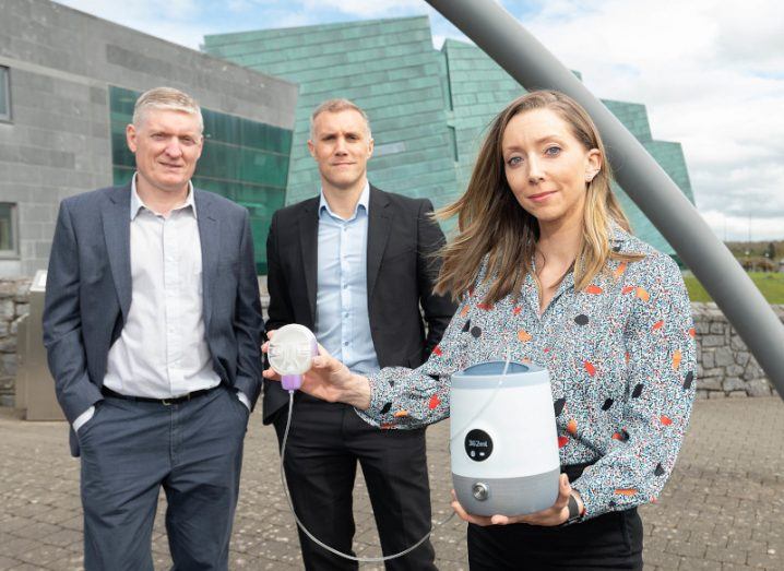 HBAN's MedTech Syndicate chair Colin Henehan, with SymPhysis Medical CEO Tim Jones and CSO Dr Michelle Tierney, standing outside and holding the company's device.