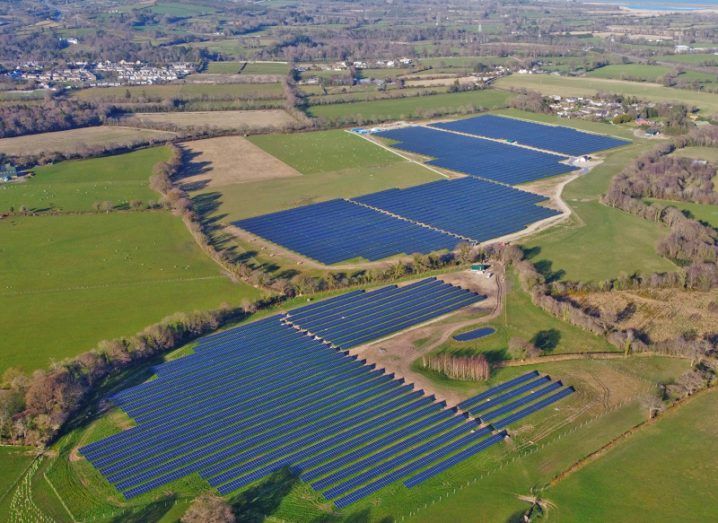 Aerial view of Neoen Millvale solar farm in Wicklow with green fields all around it.