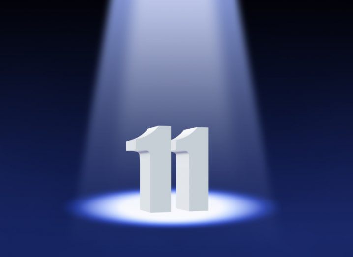 3D illustration of the number eleven under a spotlight.