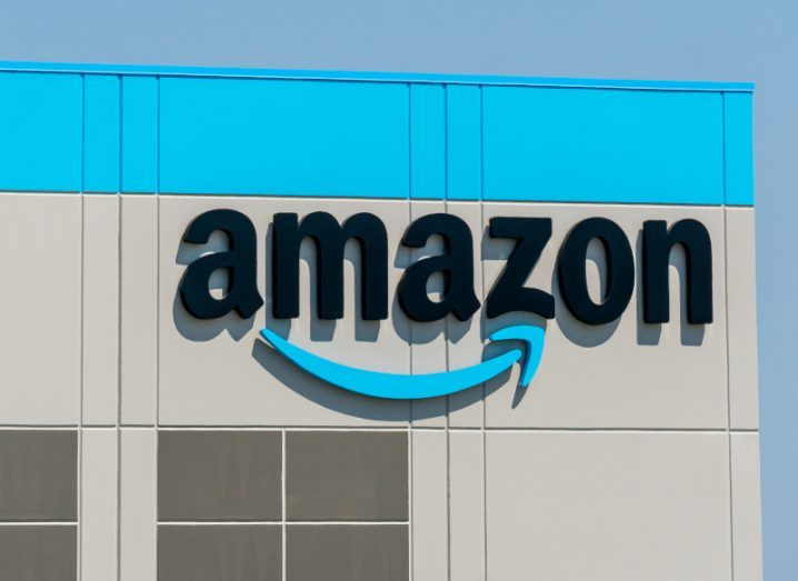 Amazon logo on a warehouse building.