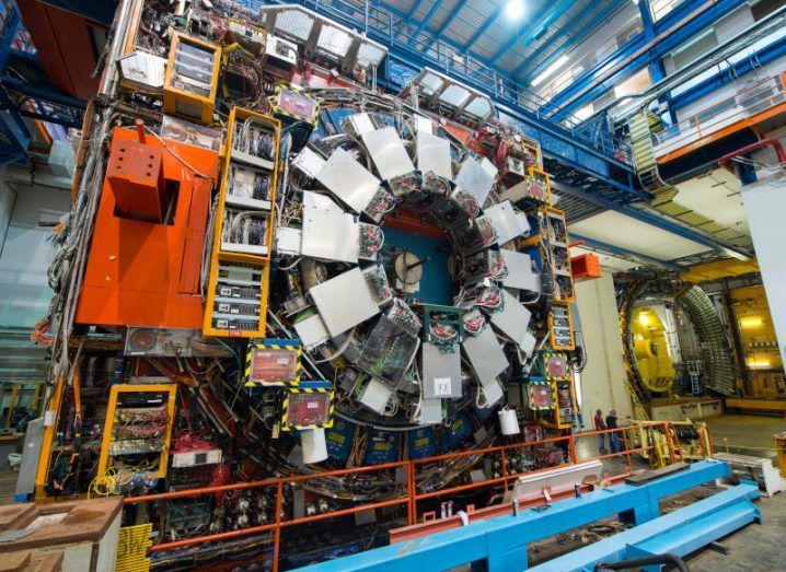 A huge collider detector with a complex juxtaposition of many electrical parts and devices.