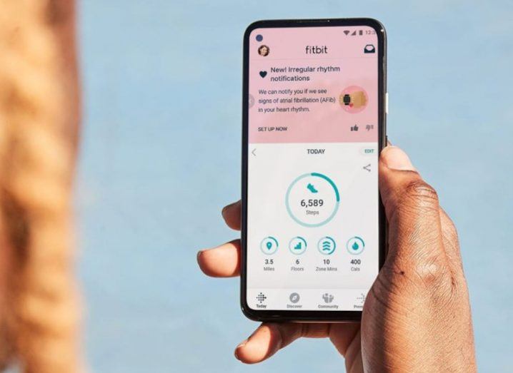 Fitbit app on a smartphone showing health data.