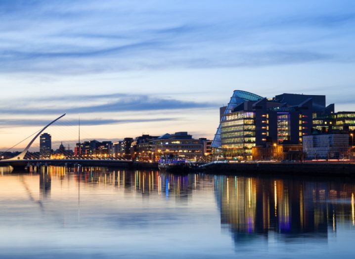 A view of Dublin’s city centre at sunset, showing the River Liffey and the buildings of the financial district.