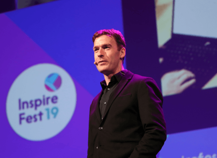 Des Traynor standing on a stage at Inspirefest 2019.