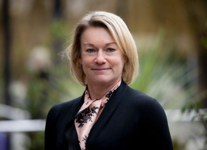 Karen Forbes, the MD of Kyndryl Ireland, smiles at the camera against a blurred background.