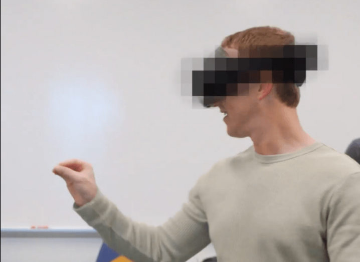 Meta CEO Mark Zuckerberg wearing a blurred mixed reality headset.