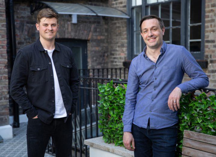 Wayflyer's founders stand outside a building.