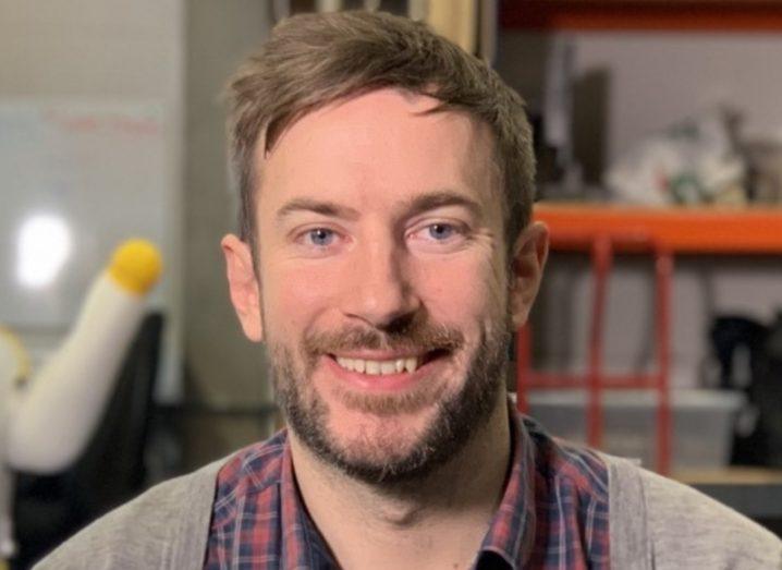 Headshot of a bearded man smiling. He is Conor McGinn of Akara Robotics.