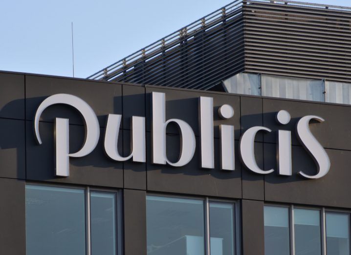 Publicis logo on a brown building.