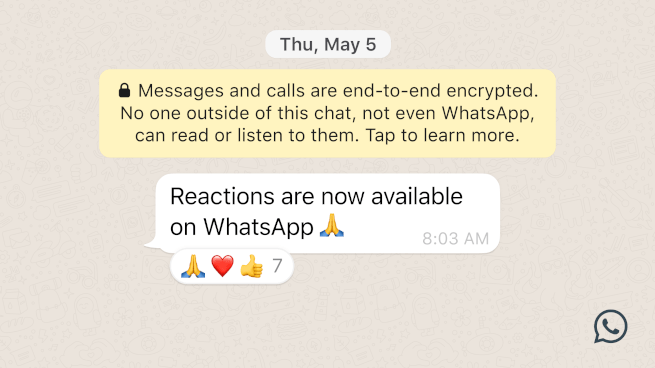 Screenshot of WhatsApp app on a phone with emoji reactions to a message that reads "Reactions are now available on WhatsApp".