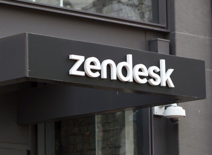Zendesk logo in front of a black building.