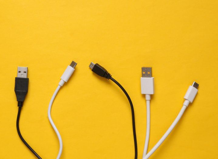Five different charging cables including USB-C types on a yellow background.