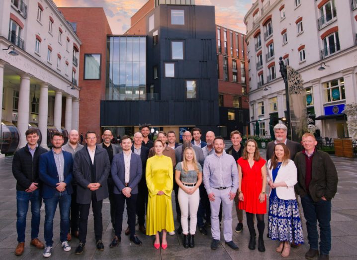 Group of casually dressed entrepreneurs from the Catalyst Co-Founders programme standing in an urban location in Northern Ireland.