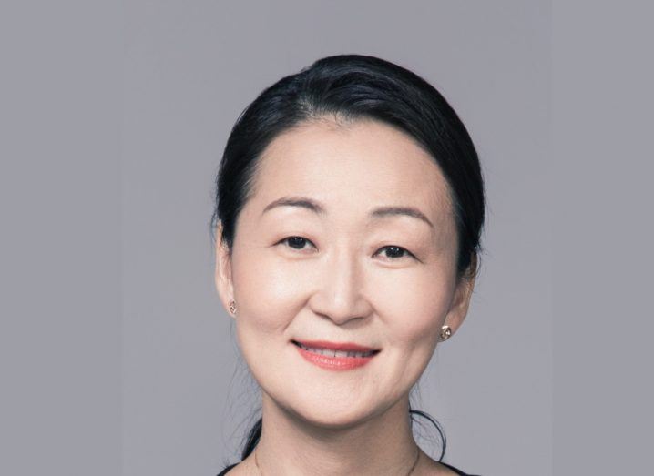 A headshot of Dr Feiyu Xu, global head of AI at SAP, against a grey background.