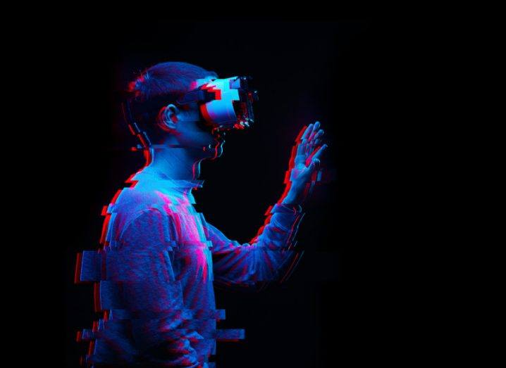 A glitchy image of a man using a virtual reality headset, which is just one example of deep tech.